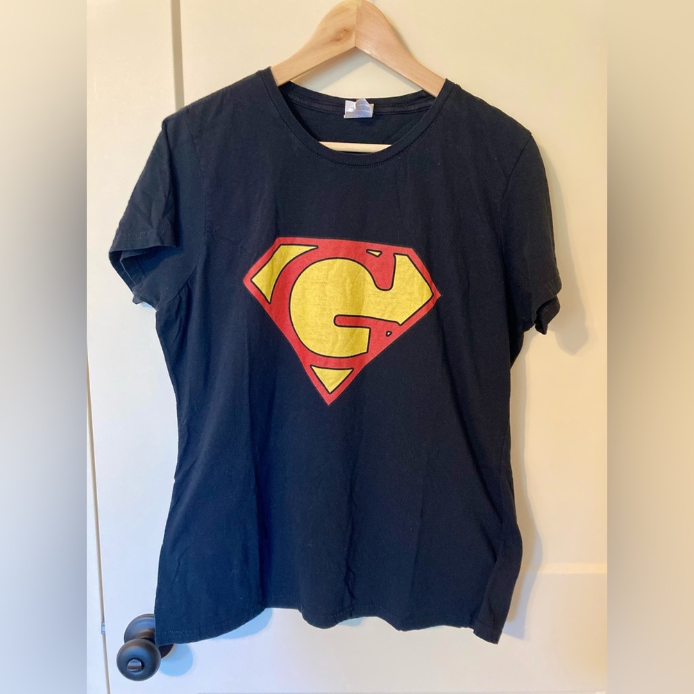 Port & Company black Superman G logo tee shirt. Good condition. Women’s Size L
